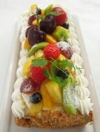 sweet roll with fruit and whipped cream