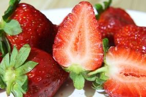 halves of ripe strawberries close up