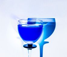 blue wineglass and its shadow