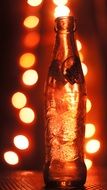 brown bottle on a background of lights