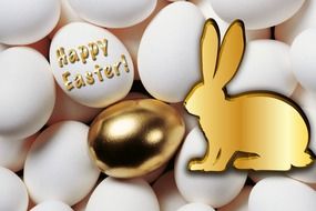 White and gold eggs with a bunny