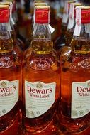 Dewar`s whisky in bottles