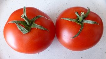 two fresh red tomatoes