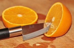 cut orange and knife