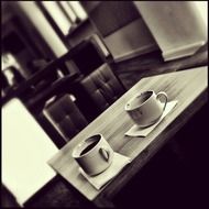 full and empty cups on table in a cafe