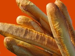 baguettes on an orange background