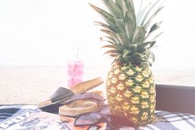 pineapple sandals sunglasses cocktail on beach