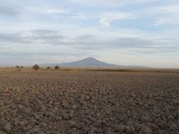 arable field on the background of a volcano