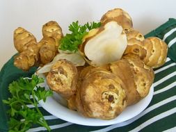Jerusalem artichoke, sunroot tubers on plate