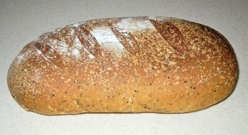 loaf of baked bread with olive oil and oregano