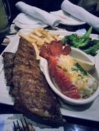 grilled lobster and fish, seafood on table