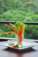 appetizer, delicious salad in glass on table outdoor