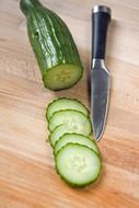 Sliced cucumber and the knife