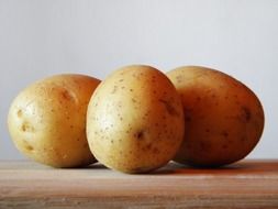 Potatoes on the wooden table