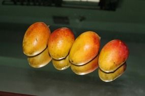 four ripe mangoes