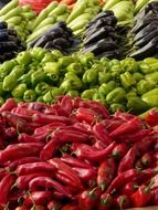 red pepper, green pepper and eggplant in the market