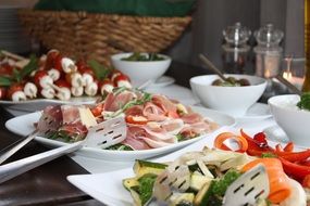buffet with white plates
