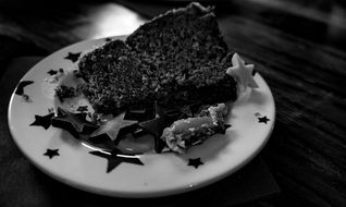 piece of cake decorated with stars on plate