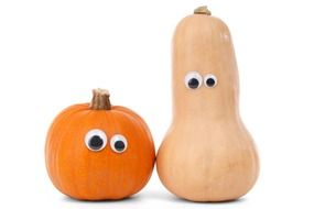 two decorated pumpkins