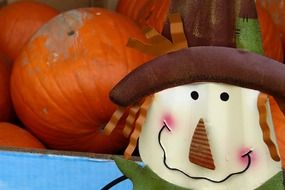 doll near the pumpkins for Halloween