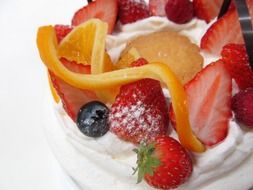 dessert with strawberries, orange and cream