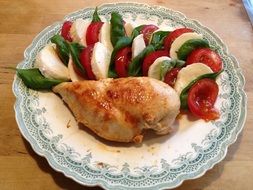 chicken with salad with mozzarella and tomatoes