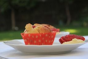 muffins with strawberries on a plate