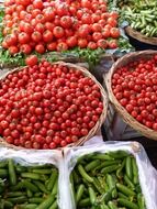 tomatoes and cucumbers at vegetable market