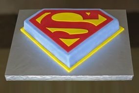 superman emblem on a cake