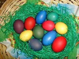 multi-colored eggs in a basket