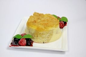 cake on a plate with fruit