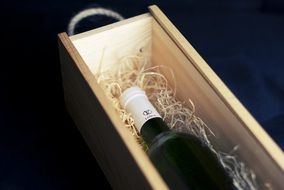 bottle of red wine in wooden box