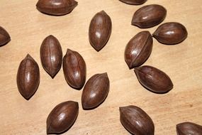 dark brown pecans nuts on table