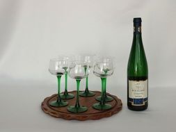 wine bottle and four glasses