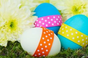 colorful eggs with ribbons for easter