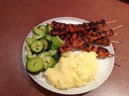 chicken on stick with mash potatoes