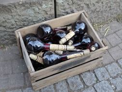 wooden box with bottles