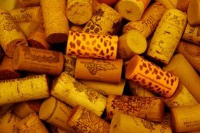 cork from the bottle of wine are in a pile