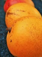 raw organic mangos fruit close-up