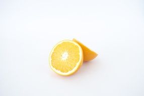 fresh slice of orange on white surface
