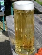 light beer in a tall glass on the table