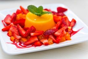 pudding with cut strawberries