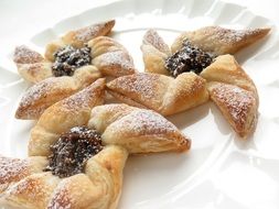 sweet pastry with jam and icing sugar