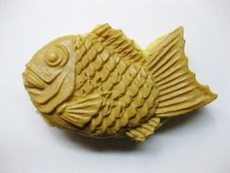 Fish figurine on a white background