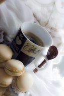 A cup of aromatic coffee with cookies