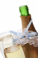 a bottle of champagne in a wedding package and two glasses