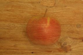 wooden board with a decorative element of the apple