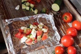 vegetables with cheese on foil