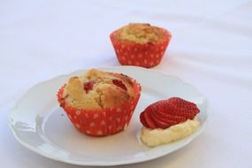 cupcake with raspberries on a plate