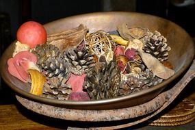 antique bowl with cones and flowers